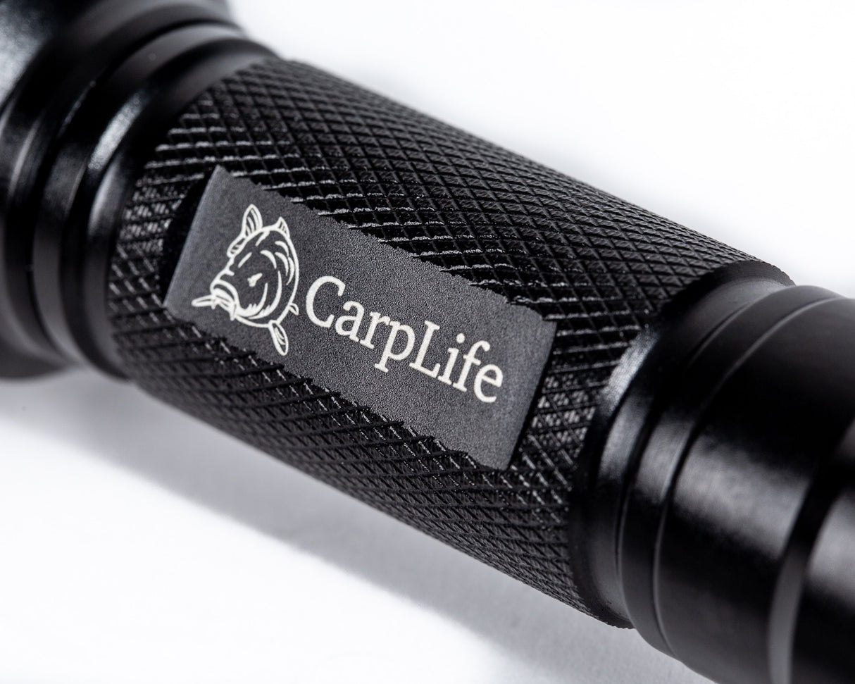 CarpLife Compact Bird Torch barrel close-up showing the etched CarpLife carp-head logo on the knurled grip