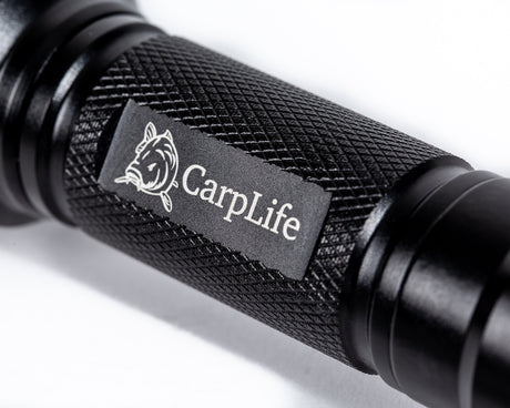 CarpLife Compact Bird Torch barrel close-up showing the etched CarpLife carp-head logo on the knurled grip