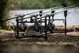 Solar A1 Aluminium Ground Pod set up low on the bank with three rods and reels
