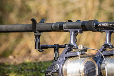 Solar Black-Lite Centre-Loc back rest fitted to a buzz bar behind two rods and reels
