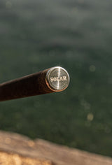 Laser-etched stainless butt cap on the carbon handle of the Solar Bow-Lite landing net