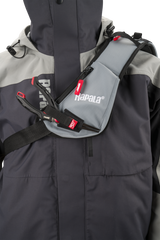 Close-up of the Rapala CountDown Sling Bag Pro padded sling strap worn across the chest, with the zipped strap pocket and tool retainers