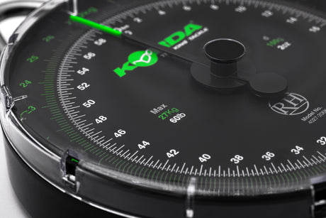 Angled close-up of the 60lb dial face, showing the green kilogram track, the white pound track and the Max 27Kg 60lb legend