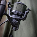 Rain-covered Obsidian on the rod at the bank, showing the spec ring, the 10 bearings rotor mark and the rotor brake lever