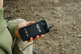 Solar S-Tron 20K pocket powerpack held in one hand with a cable plugged in