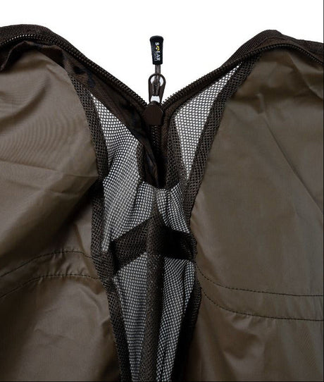 Interior close-up: the sling opened to show the quick-drain mesh panel running down the middle and the zip with a SOLAR TACKLE branded pull and its clip.