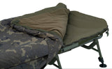 The modular bag opened at the corner to show the layers: camo outer, olive smooth face and a thick fleece layer folded back, plus the moulded crash zip. This is the reversible-laye