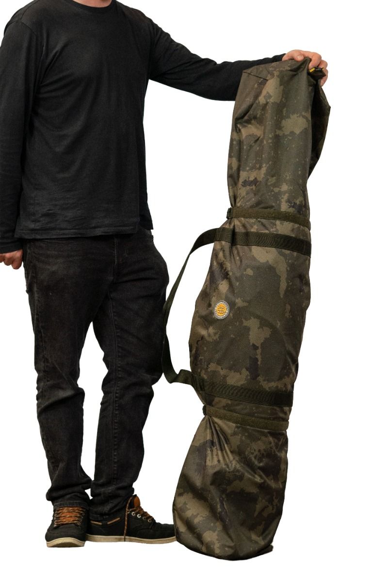 The camo carry bag supplied with the Solar Worldwide Spider FS bivvy, held for scale